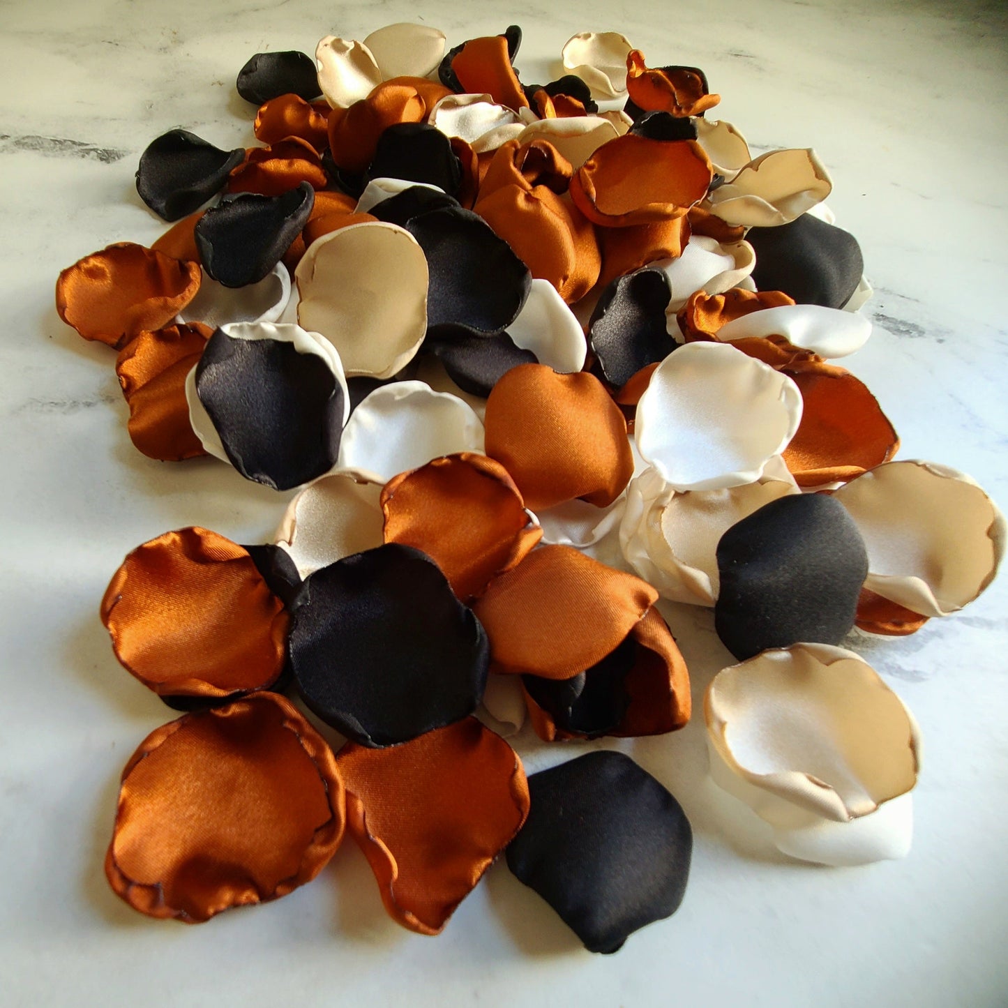 Fall wedding decor using Burnt Orange, Ivory, beige, black rose petals. Flower girl petals for tossing, aisle decor or table confetti, custom color options