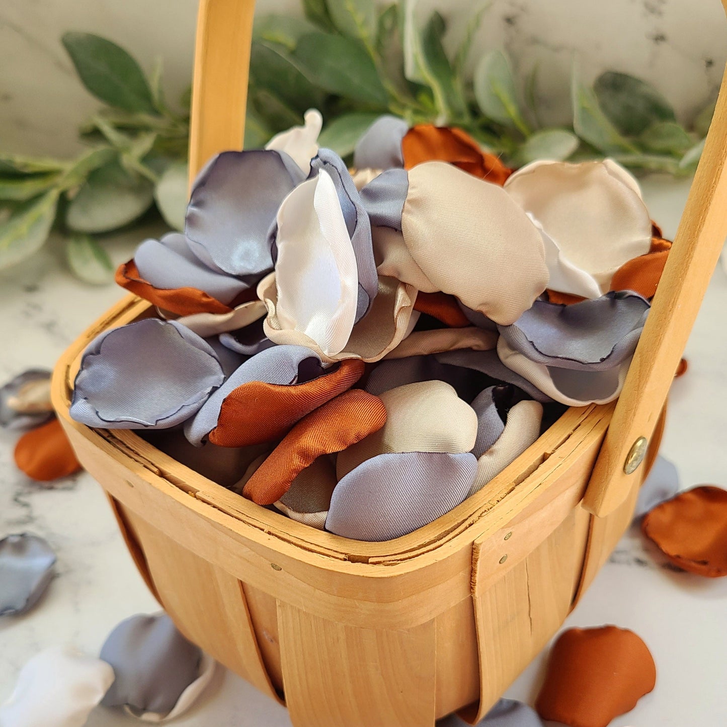 Western Wedding Flower Girl basket with dusty blue, beige, ivory, terracotta rose petals