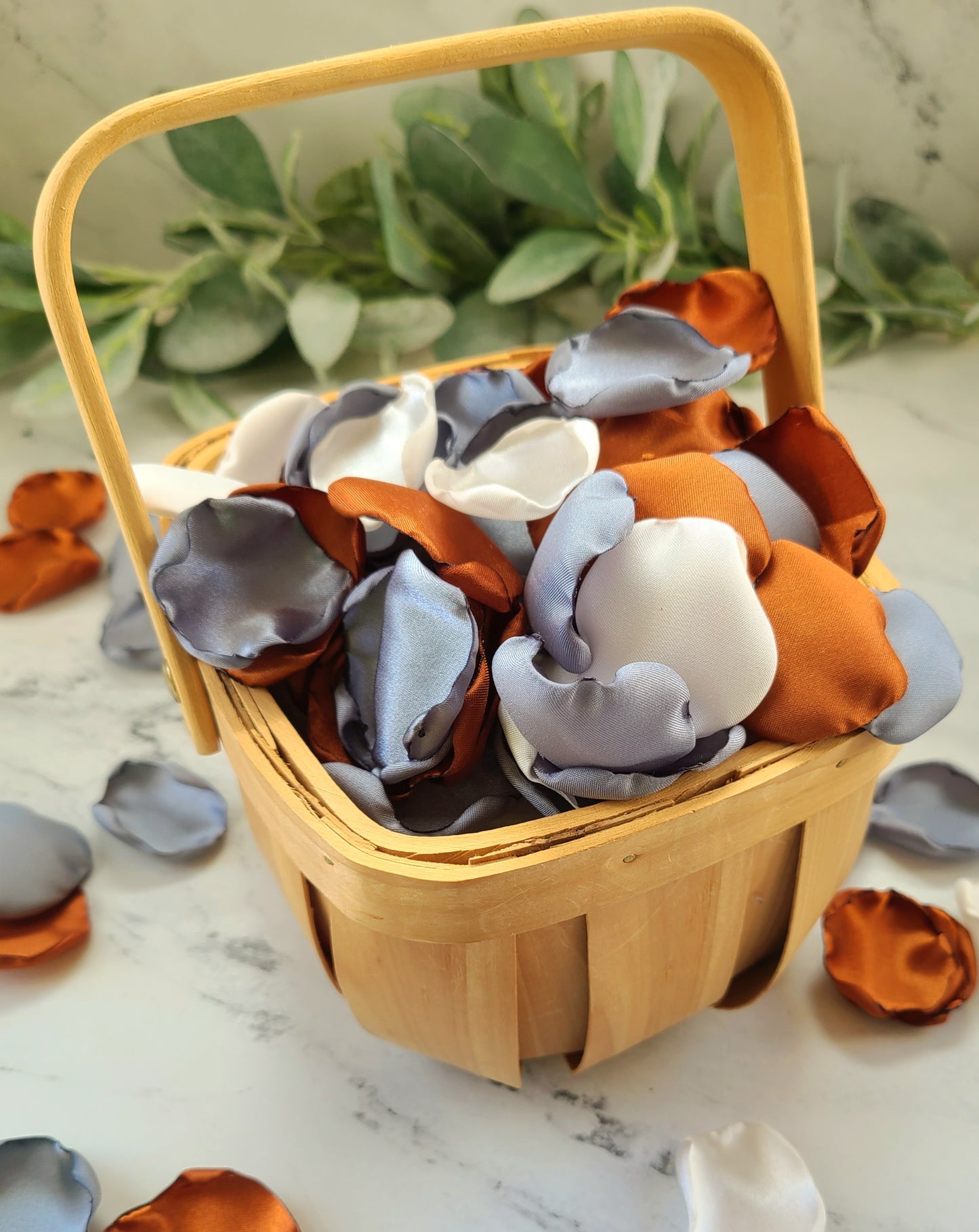 Rustic flower girl basket filled with dusty blue, ivory, beige and Terracotta Rose Petals. Petal Patrol box