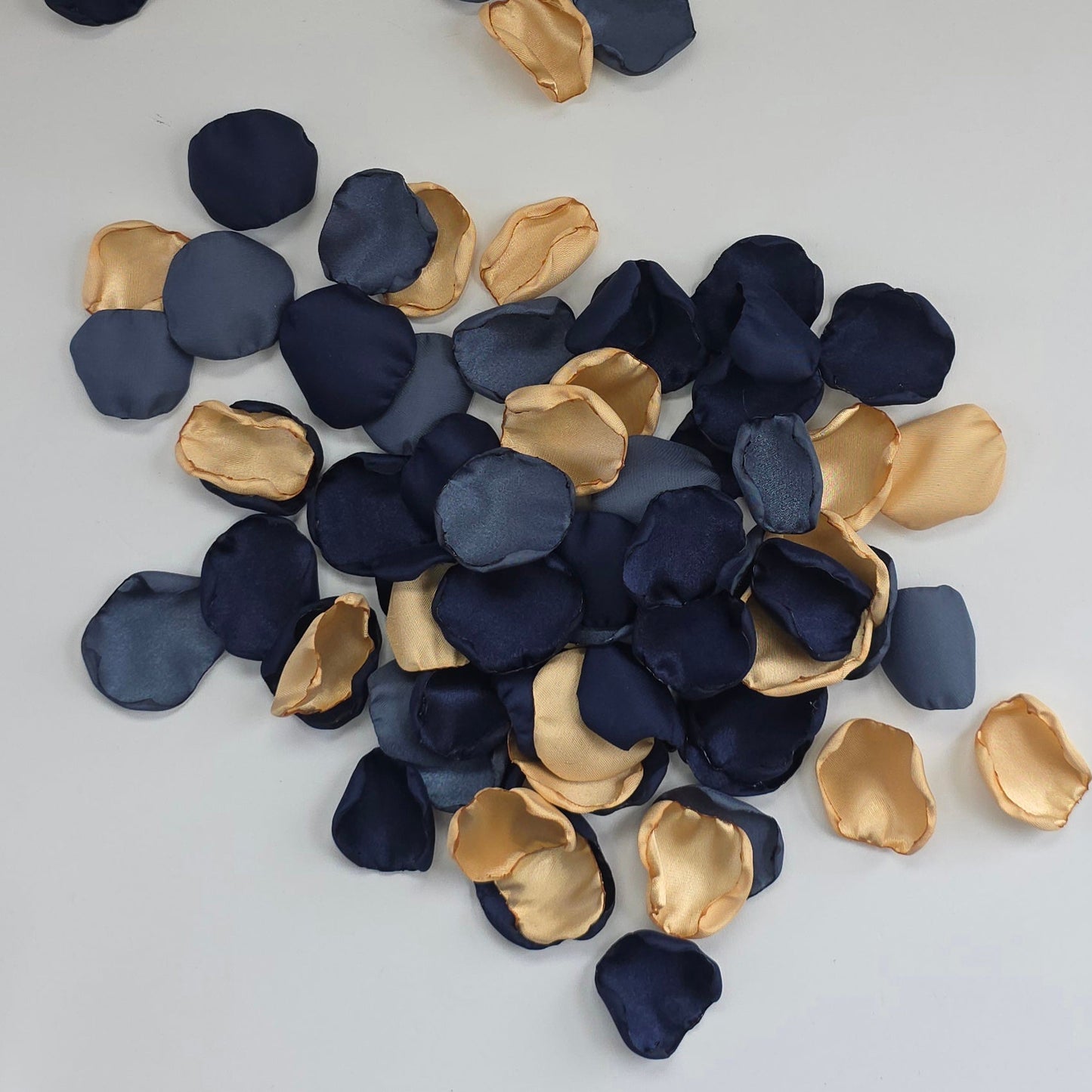 A mix of Gold, Navy, dusk stormy blue rose petals. Perfect for flower girl tossing, wedding aisle decor, confetti, tablescapes accents, backdrop scatter. For future brides planning a celestial wedding or bridal shower event.