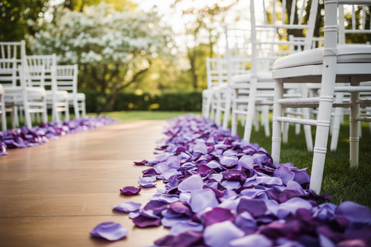 A mix of purple, wisteria, and lavender rose petals showcased along the wedding aisle