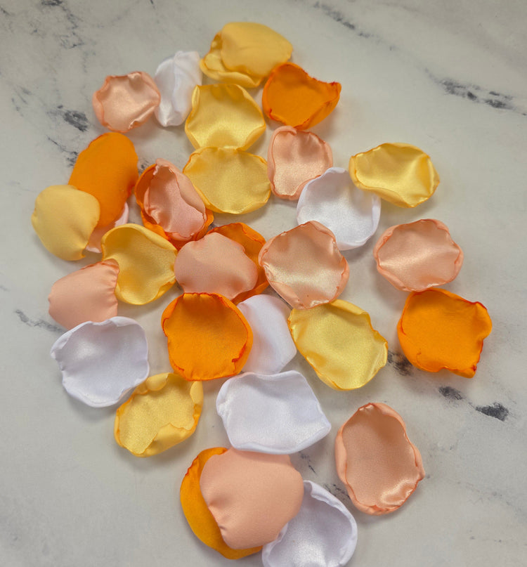 Tangerine Orange, peach blush, and Yellow rose petals for Whimsical Wedding theme color ideas