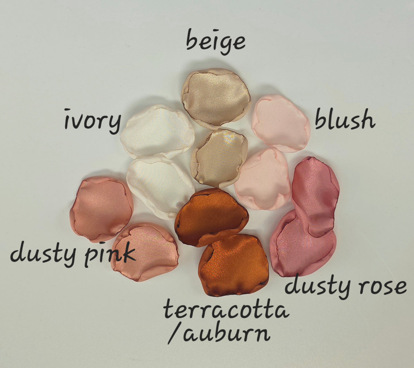 Auburn, burnt orange, beige, blush pink rose petals for flower girl tossing, aisle decor, flatlays, backdrop accents or tablescape table scatter, decor ideas. A fall color palette for the future bride planning a western, rustic wedding ceremony or natural, nuetral colored bridal shower event