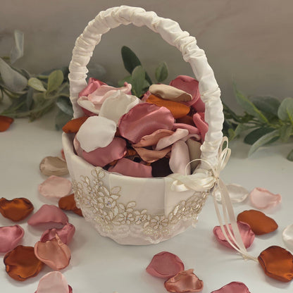 Auburn, burnt orange, beige, blush pink rose petals in Ivory basket for flower girl tossing, aisle decor, flatlays, backdrop accents or tablescape table scatter, decor ideas. A fall color palette for the future bride planning a western, rustic wedding ceremony or natural, nuetral colored bridal shower event