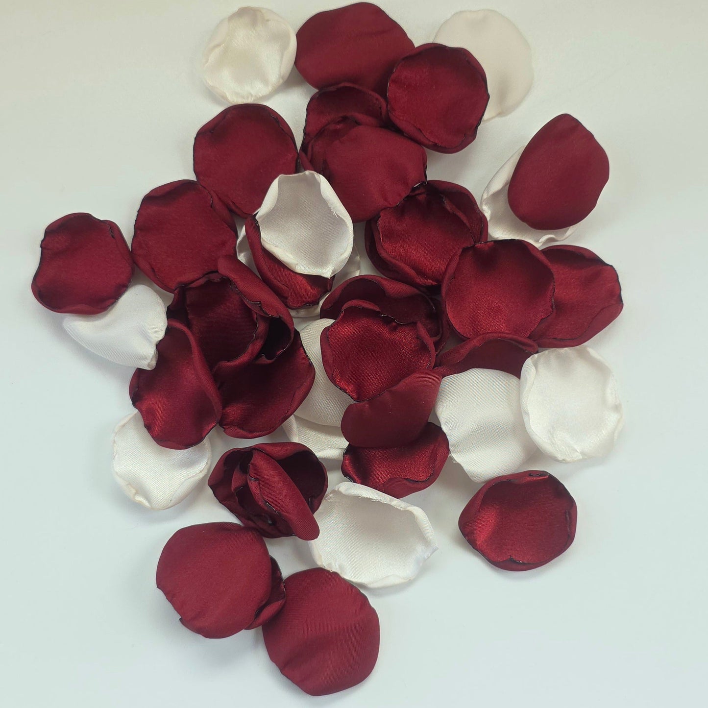 Burgundy, Ivory rose petals for flower girl tossing, aisle decor, classic fall wedding decor. Ideas for future brides planning an elegant, boho wedding ceremony or bridal shower event.