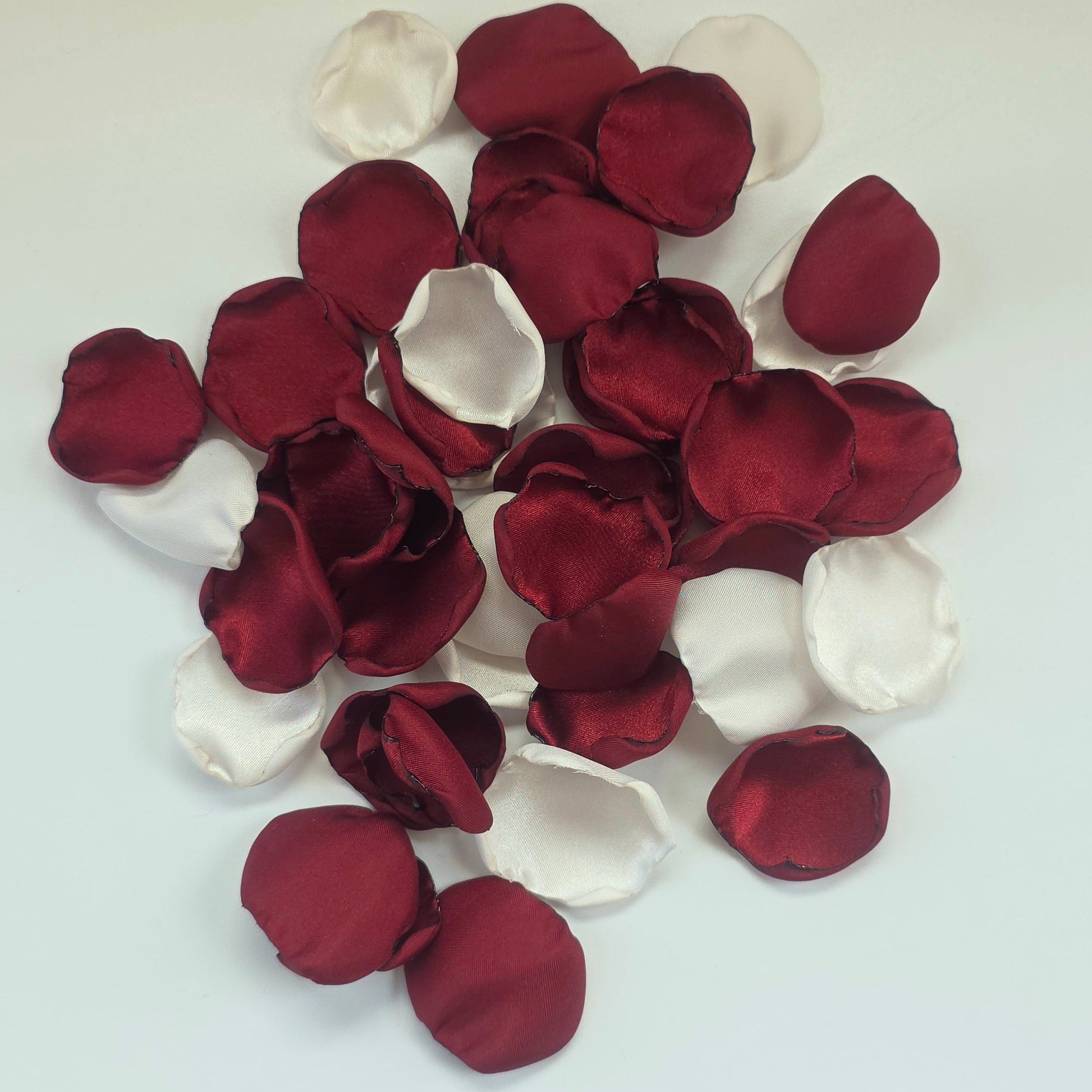 Burgundy, Ivory rose petals for flower girl tossing, aisle decor, classic fall wedding decor. Ideas for future brides planning an elegant, boho wedding ceremony or bridal shower event.