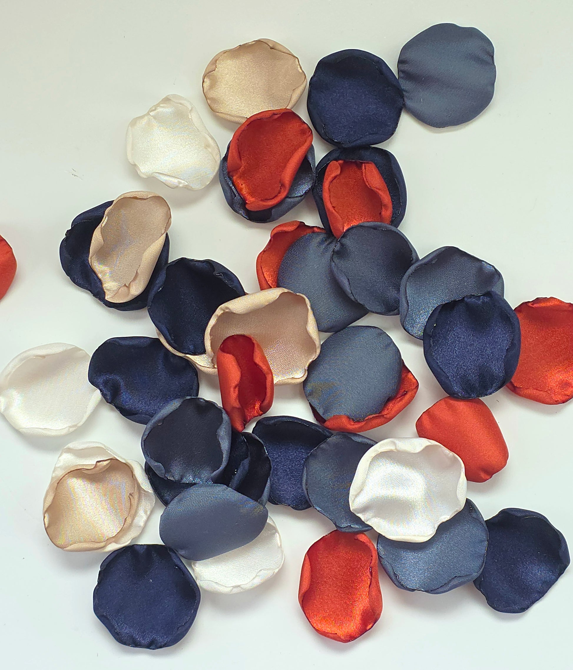 Burnt orange, navy blue, beige and ivory rose petals for flower girl toss, aisle decor, fall wedding decor, receptions tablescape scatter, confetti, ceremony backdrop accents, and future bride wedding color palette ideas