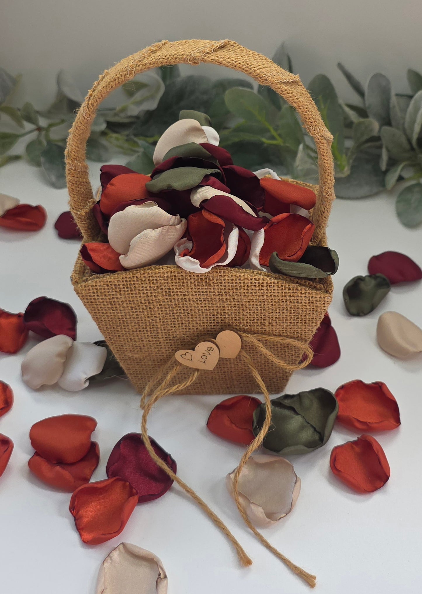 Burnt Orange, Beige, Olive. Burgundy rose petals in rustic boho basket. Perfect for flower girl tossing, baskets, photo flatlays, table scatter. or aisle decor. Wedding Decor ideas For Future brides planning a fall wedding ceremony or a western inspired bridal shower event.