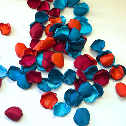 A mix of  burgundy, burnt orange, dark and light teal rose petals for flower girl tossing, baskets, aisle decor or tablescape  confetti scatter. Ideas for future brides planning a jewel toned wedding ceremony or fall bridal shower event.