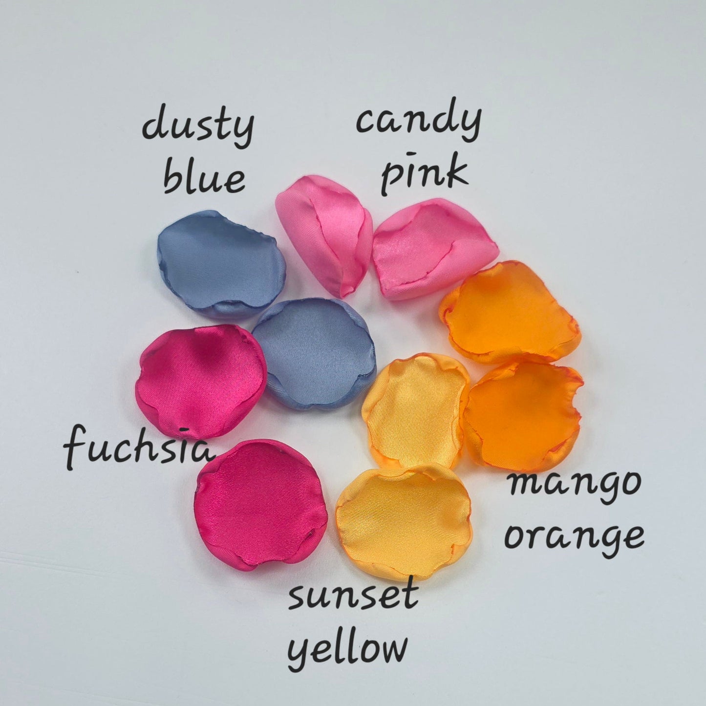 A mix of Tangerine Mango Orange, Fuchsia, Candy pink, sunset orange and dusty blue rose petals. Perfect for aisle decor, flower girl tossing. table scatter, backdrop accents or photo flatlays ideas. A golden hour, topical, and sunset vibes for a future bride planning a wedding ceremony or bridal shower event. A bold colorful, modern color palette inspiration and wedding decor ideas. 