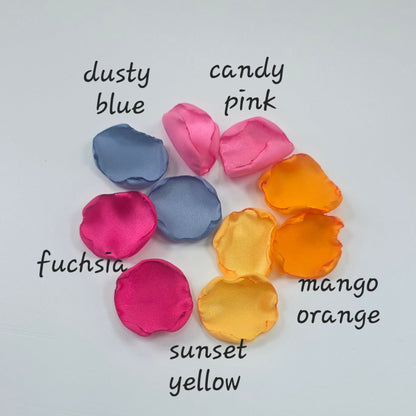A mix of Tangerine Mango Orange, Fuchsia, Candy pink, sunset orange and dusty blue rose petals. Perfect for aisle decor, flower girl tossing. table scatter, backdrop accents or photo flatlays ideas. A golden hour, topical, and sunset vibes for a future bride planning a wedding ceremony or bridal shower event. A bold colorful, modern color palette inspiration and wedding decor ideas. 