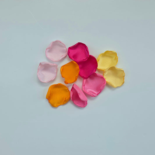 Orange, Yellow, Pink and Fuchsia rose petals for a Whimsical wedding theme color ideas, Petals scattered on tablescape, flower girl tossing, confetti scatter, backdrop accents, sunset wedding color ideas