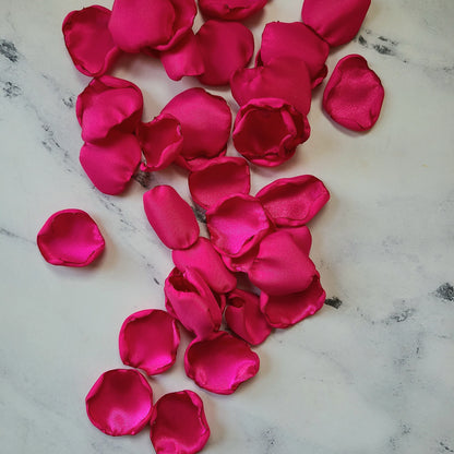 Fuchsia pink and ivory rose petals showcased on tabletop. Perfect for tablecapes decor, flower girl toss, wedding aisle decor, confetti scatter, amazing additions to ceremony backdrop props, future bride ideas