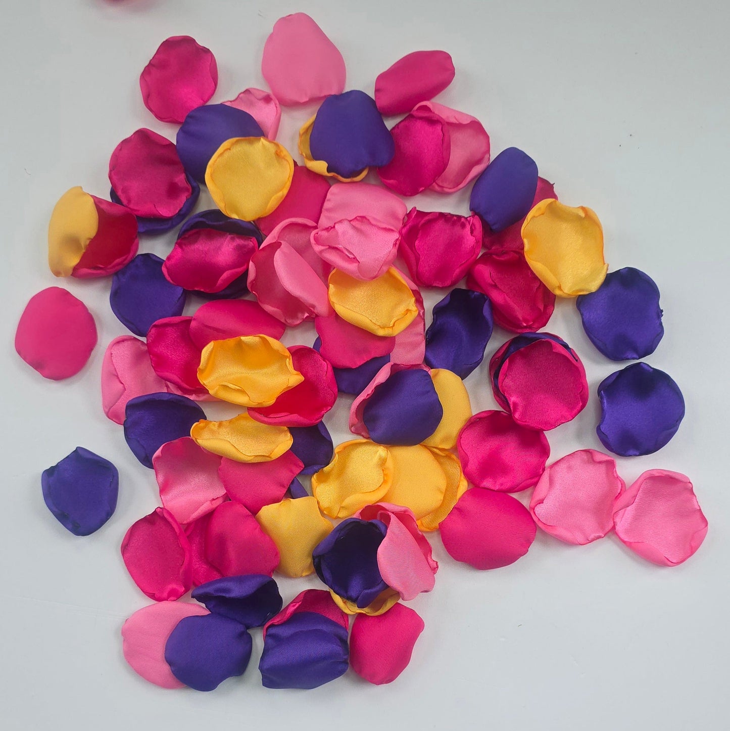 A mix of Fuchsia, Candy Pink, Dark Purple and Sunflower Yellow rose petals. For flower girl tossing,  aisle decor, reception tablescape scatter, backdrop accents or wedding decor. A bold colorful palette for future brides planning a golden hour sunset wedding ceremony or whimsical bridal shower brunch event.