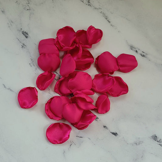 Fuchsia pink and ivory rose petals showcased on tabletop. Perfect for tablecapes decor, flower girl toss, wedding aisle decor, confetti scatter, amazing additions to ceremony backdrop props, future bride ideas