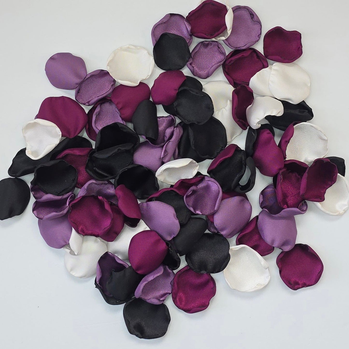 Fig, Plum, black , Ivory, and Wisteria Purple rose petals. For flower girl tossing, baskets, church pew, aisle decor, flatlays, table scatter, reception table decorations. A fall color palette for a future bride planning a celestial themed wedding or nautical bridal shower event.