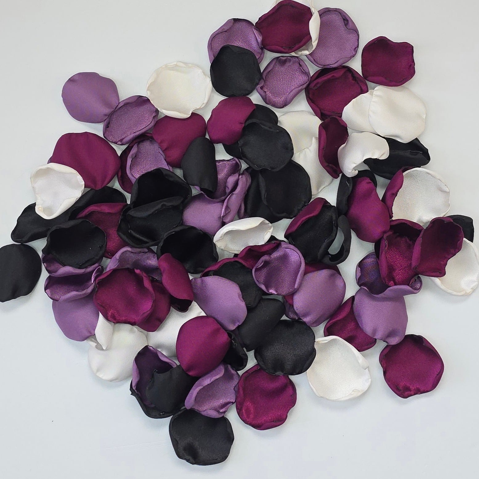 Fig, Plum, black , Ivory, and Wisteria Purple rose petals. For flower girl tossing, baskets, church pew, aisle decor, flatlays, table scatter, reception table decorations. A fall color palette for a future bride planning a celestial themed wedding or nautical bridal shower event.