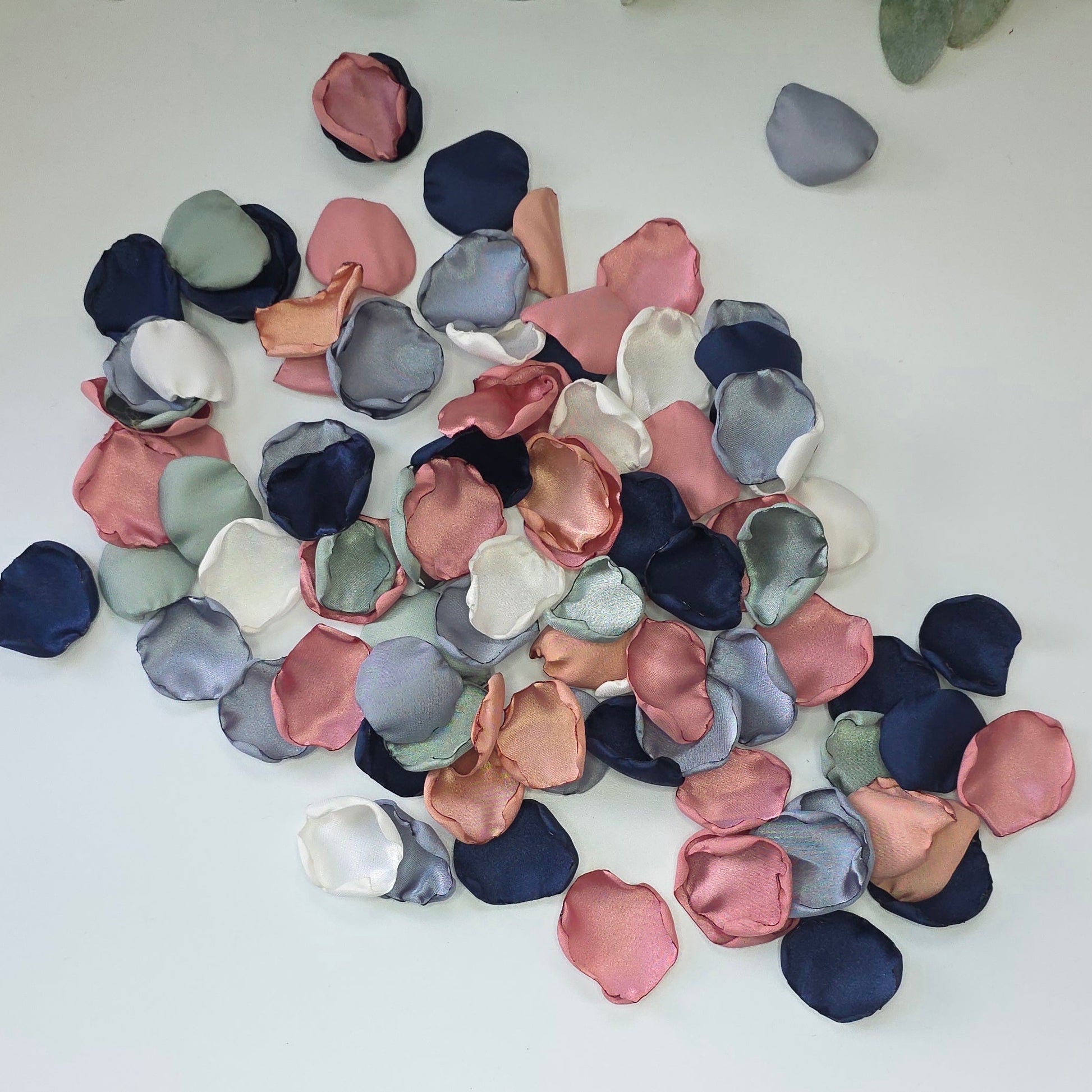 A mix of Dusty Blue, Navy, Dusty Rose, champagne rose pink, dusty sage rose petals. Perfect for flower girl tossing, aisle decor, inspo for wedding decor, tablescape scatter or backdrop accents. A color palette for a future bride planning a wedding ceremony or bridal shower brunch event.