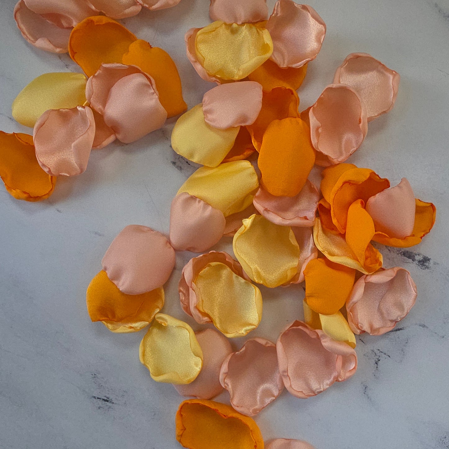 Yellow, Peach Blush, Orange rose petals showcased on table. Perfect for flower girl tossing, wedding aisle decor, reception tablescapes, confetti scatter,  memory table accents, Sunset Wedding Theme Ideas