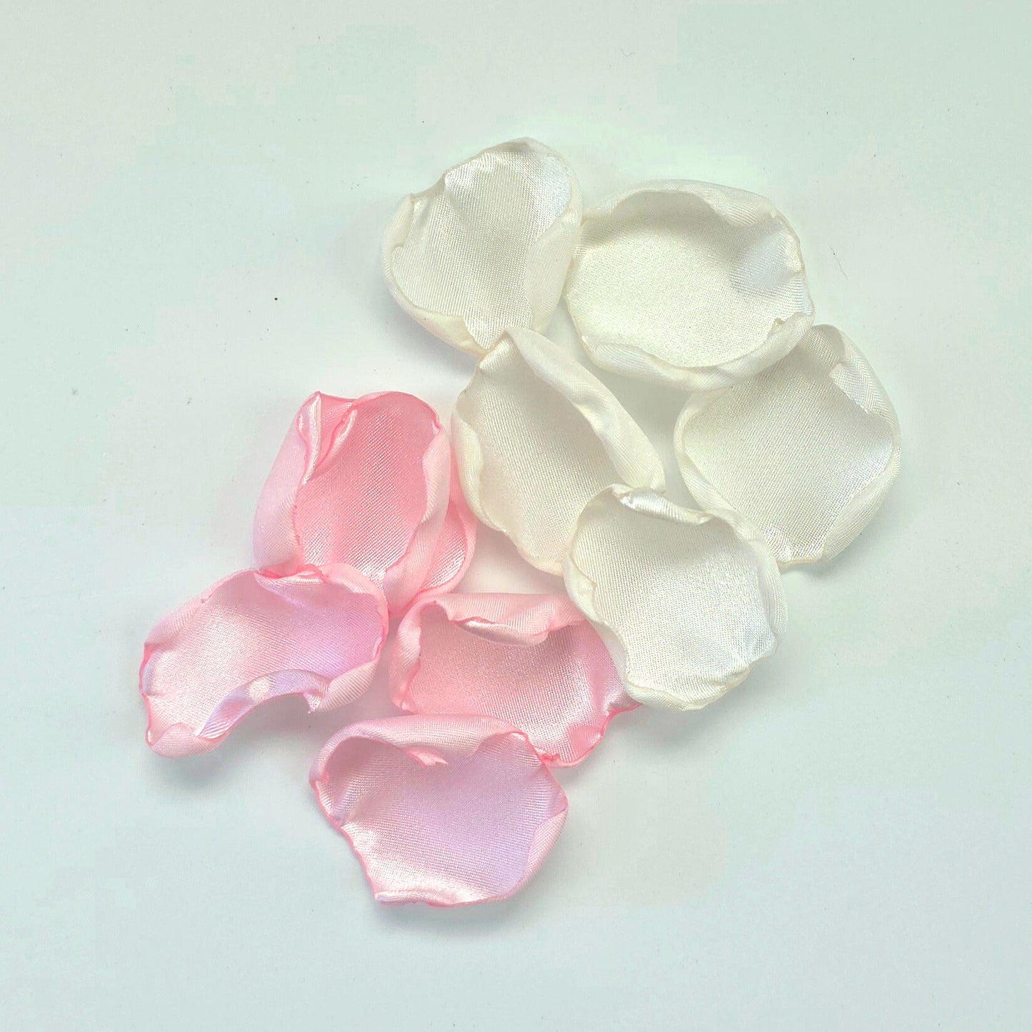 A mix of pink and white rose petals for a future bride using a pink wedding color palette. For flower girl toss, aisle decor, tablescape ideas or confetti scatter.
