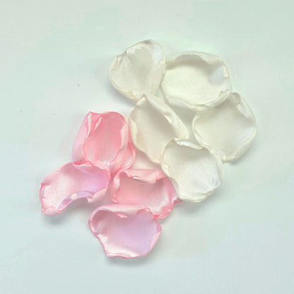 A mix of pink and white rose petals for a future bride using a pink wedding color palette. For flower girl toss, aisle decor, tablescape ideas or confetti scatter.
