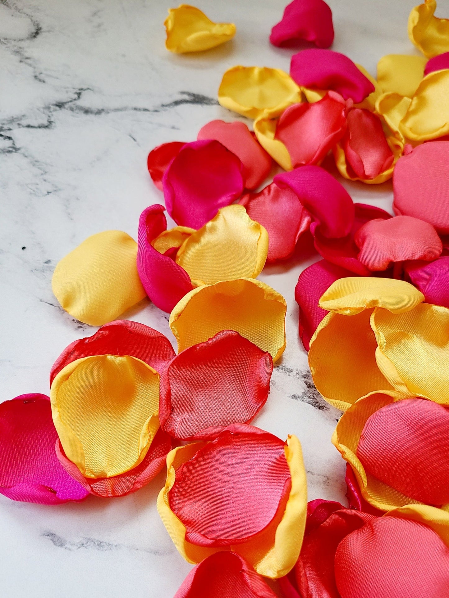 Pink, yellow and Coral Rose petals for wedding ceremony