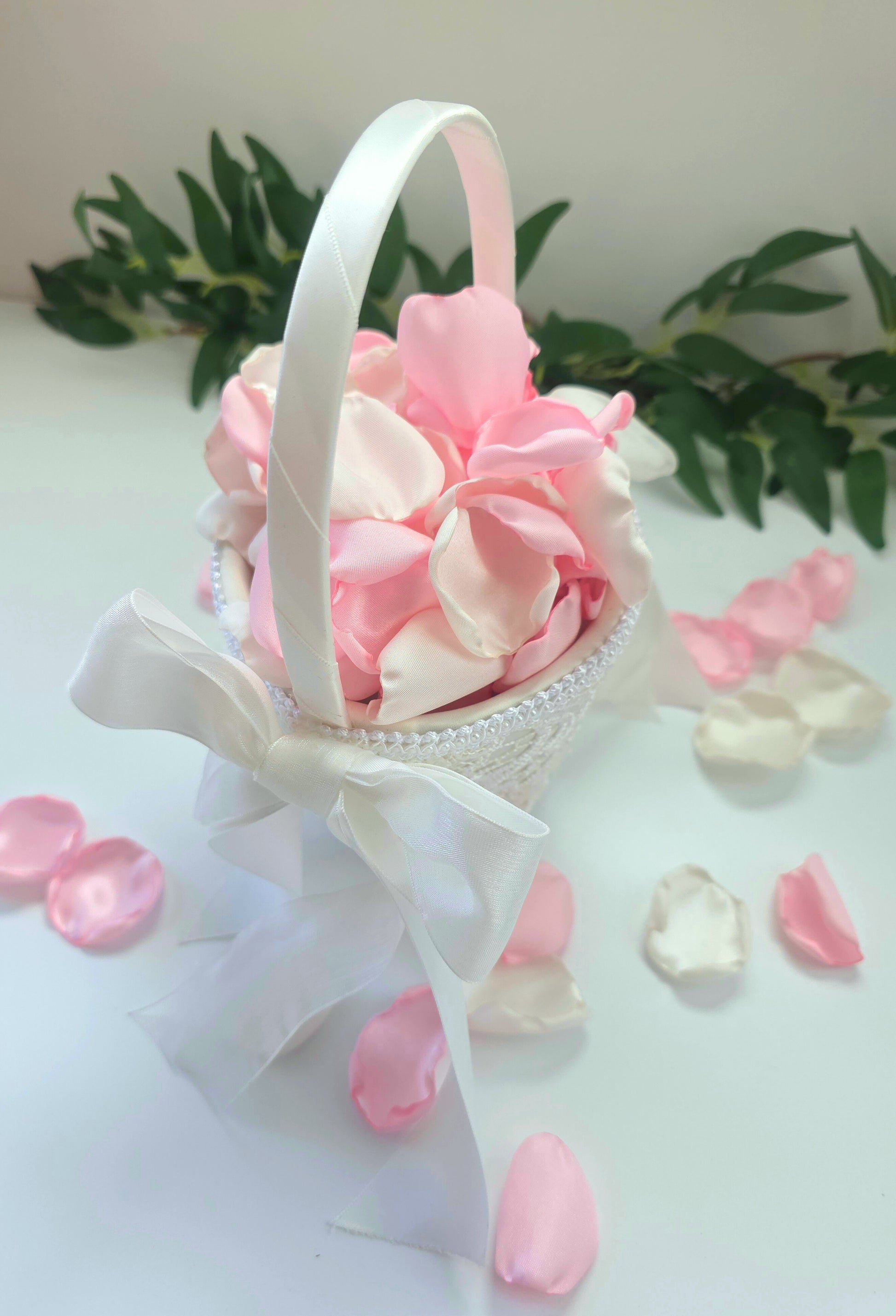 A mix of pink and white rose petals in flower girl basket. For future brides using a pink wedding color palette. For flower girl toss, aisle decor, tablescape decor ideas or confetti scatter.