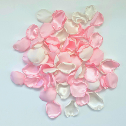 A mix of pink and white rose petals for a future bride using a pink wedding color palette. For flower girl toss, aisle decor, tablescape decor ideas or confetti scatter.