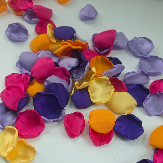 A mix of yellow, lavender purple, mango orange and fuchsia pink rose petals. Perfect for flower girl tossing, baskets, aisle decor, backdrop accents, reception table scatter. A colorful bold color palette for a future bride planning a whimsical bridal shower event or sunset wedding ceremony.