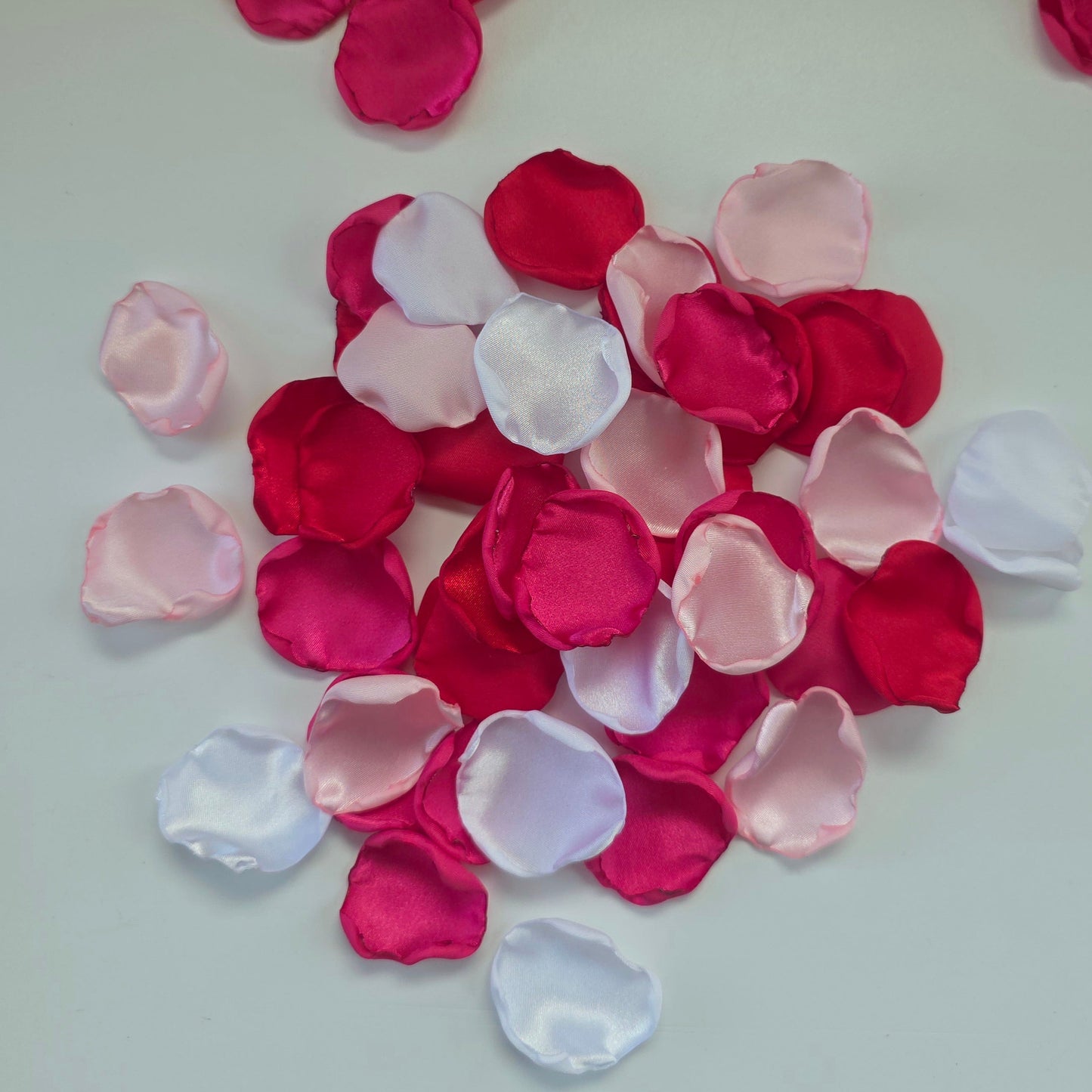 Red, fuchsia, pink and white rose petals for wedding aisle decor, flower girl toss, valentine date night tablescape decor, future bride color scheme ideas, confetti