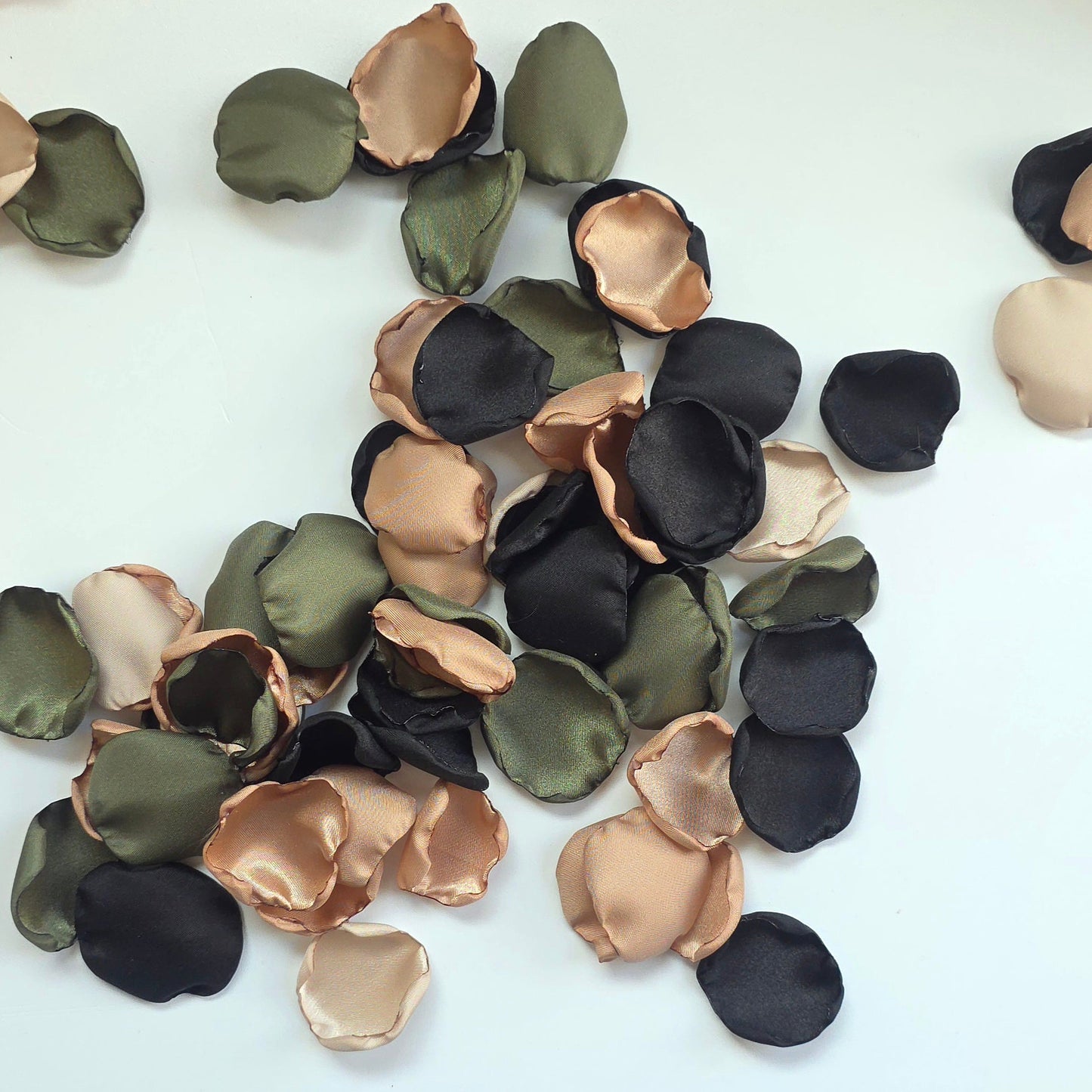A mix of olive green, tan, beige and black rose petals. Perfect for flower girl tossing, flatlays, table scatter, confetti exit,wedding aisle decor.  For future brides planning a Camouflage wedding or hunting couples shower event.