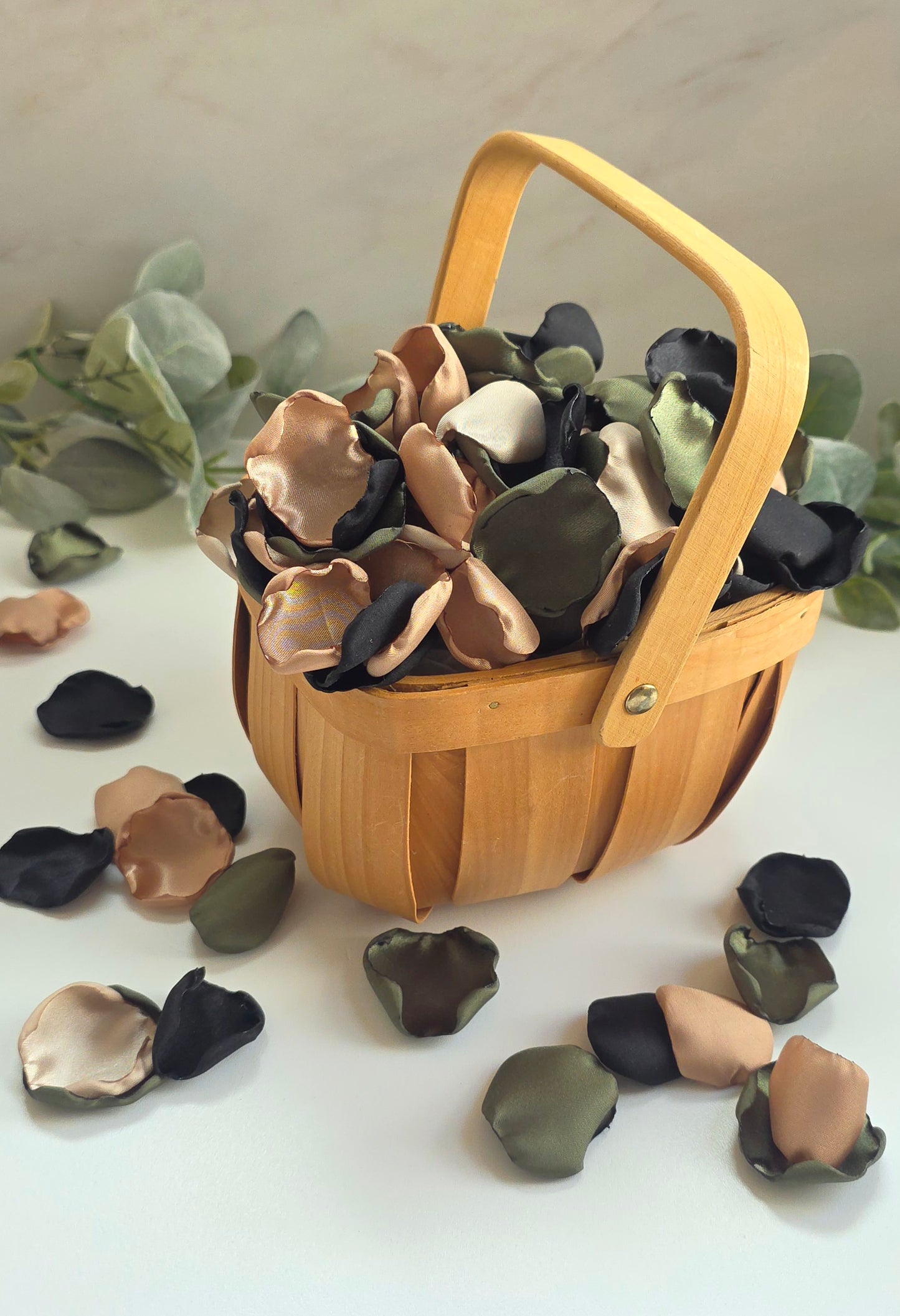 A mix of olive green, tan, beige and black rose petals in rustic flower girl basket. Perfect for flower girl tossing, flatlays, table scatter, confetti exit,wedding aisle decor.  For future brides planning a Camouflage wedding or hunting couples shower event.