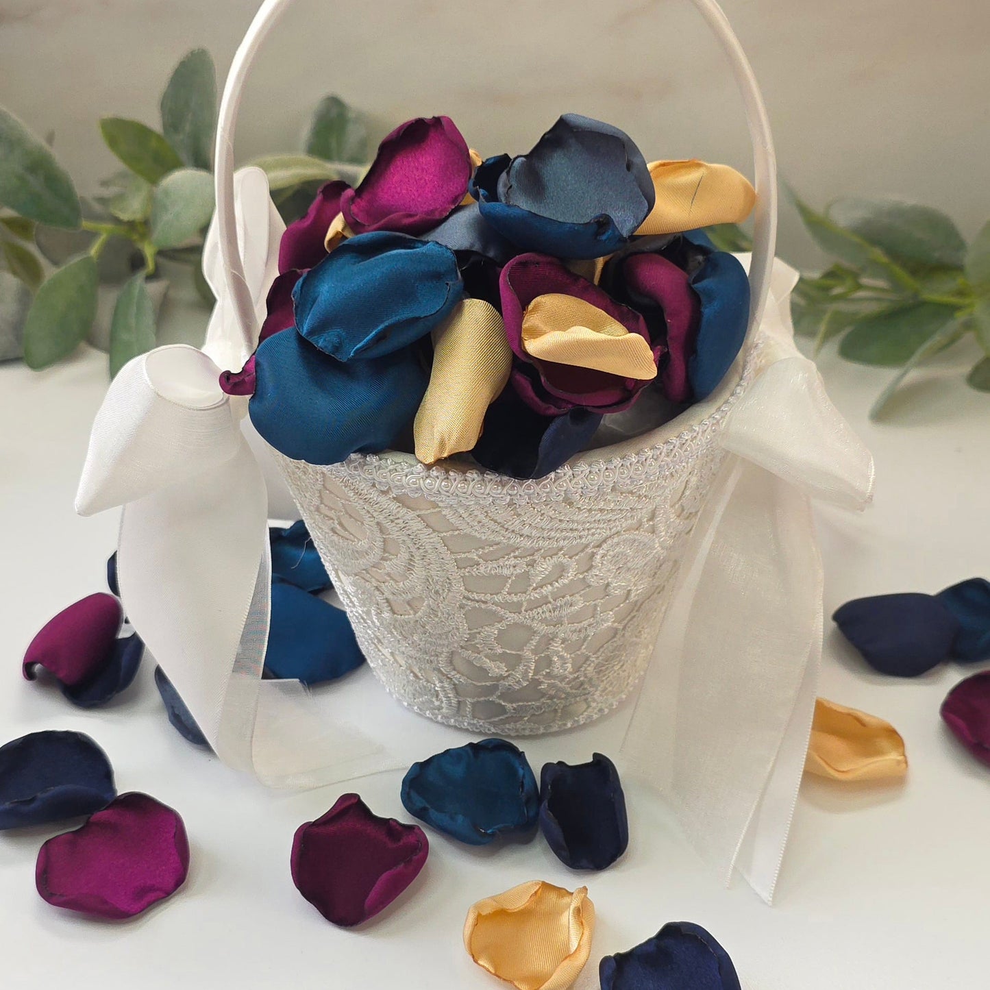 Teal Fig Mulberry, gold, navy and stormy blue rose petals in flower girl baskets, flower girl toss for a twilight starry night, celestial themed wedding ceremony or bridal shower table scatter, confetti. A Fall color palette for a future bride planning a jewel-toned wedding.