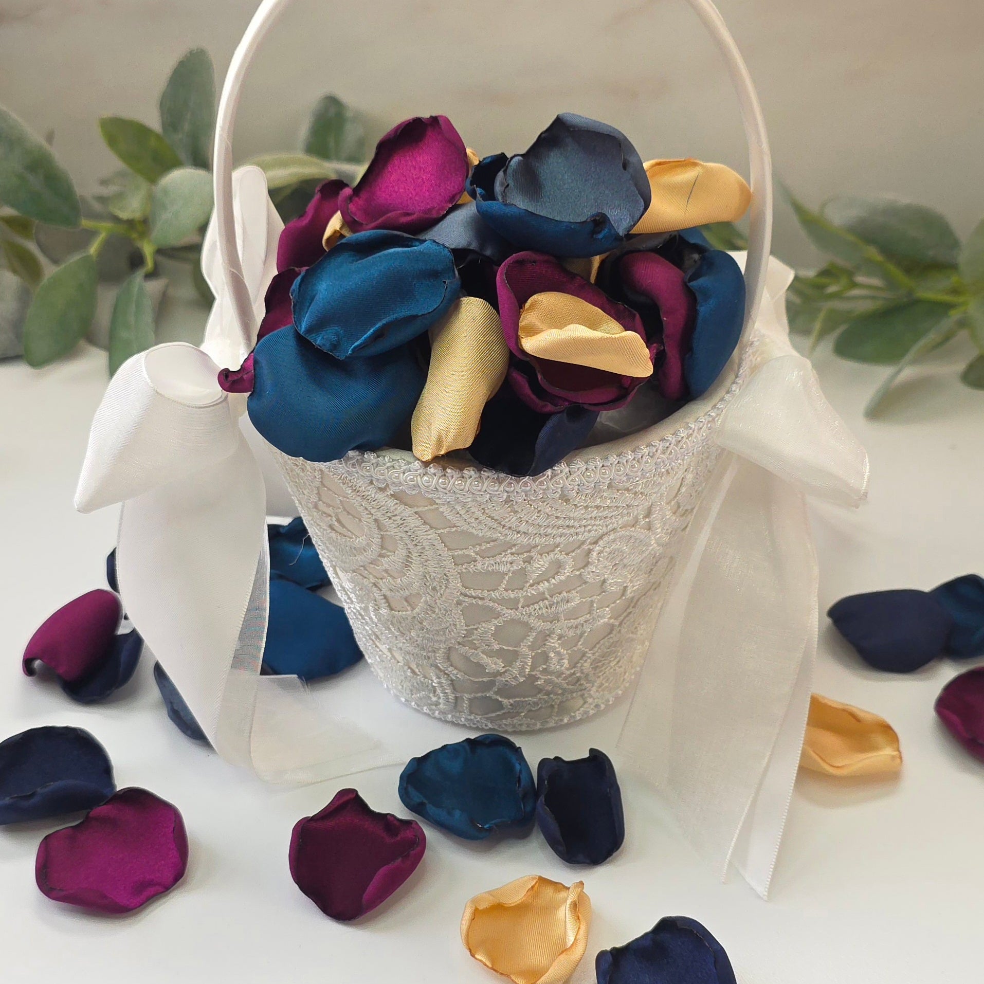 Teal Fig Mulberry, gold, navy and stormy blue rose petals in flower girl baskets, flower girl toss for a twilight starry night, celestial themed wedding ceremony or bridal shower table scatter, confetti. A Fall color palette for a future bride planning a jewel-toned wedding.