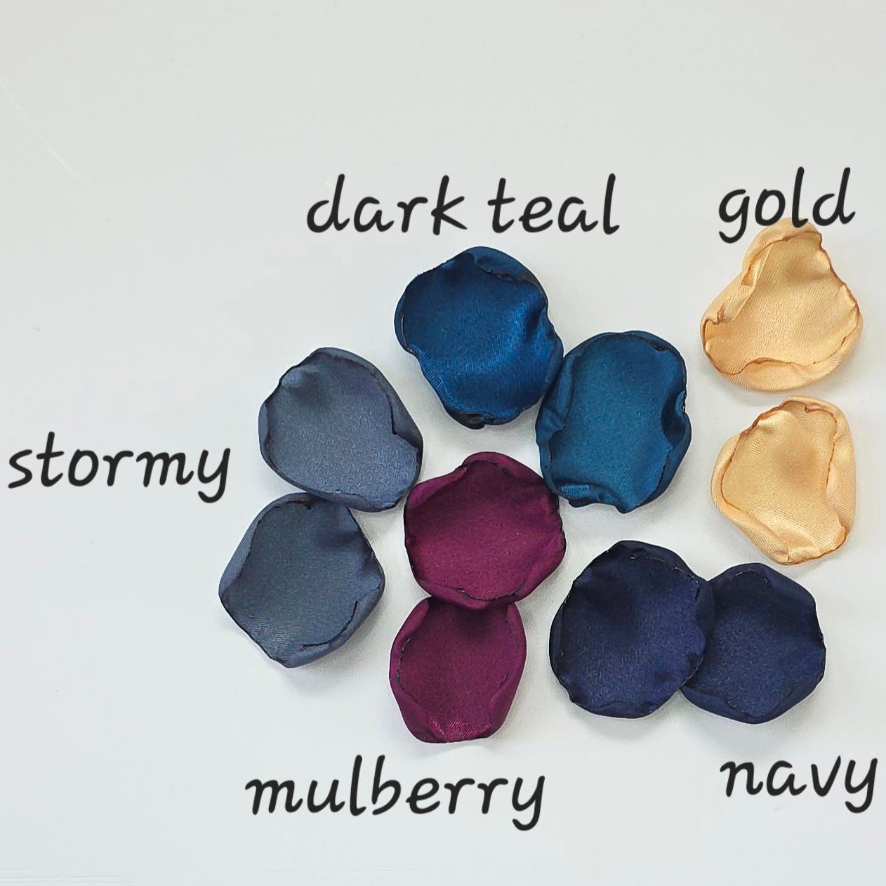 Teal Fig Mulberry, gold, navy and stormy blue rose petals for a twilight starry night, celestial themed wedding ceremony or bridal shower table scatter, confetti. A Fall color palette for a future bride planning a jewel-toned wedding.