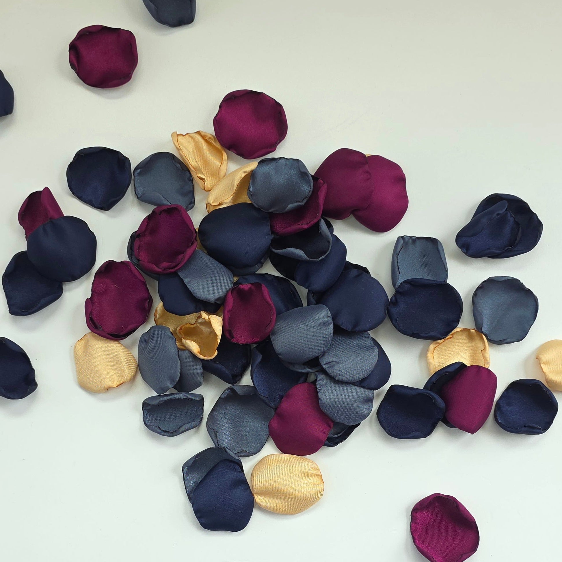 Teal Fig Mulberry, gold, navy and stormy blue rose petals for a twilight starry night, celestial themed wedding ceremony or bridal shower table scatter, confetti. A Fall color palette for a future bride planning a jewel-toned wedding.