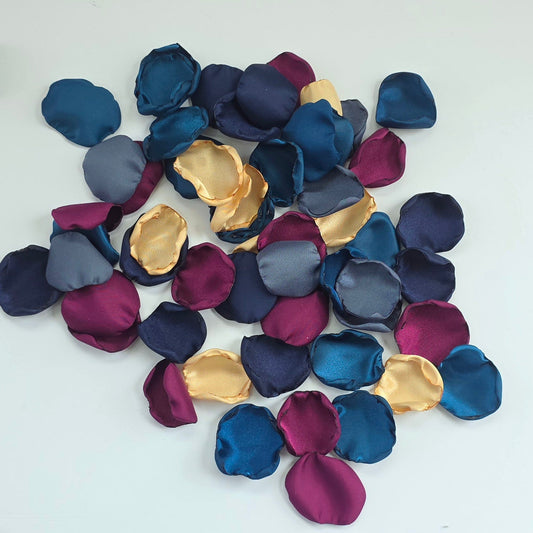 Teal Fig Mulberry, gold, navy and stormy blue rose petals for a twilight starry night, celestial themed wedding ceremony or bridal shower table scatter, confetti. A Fall color palette for a future bride planning a jewel-toned wedding.