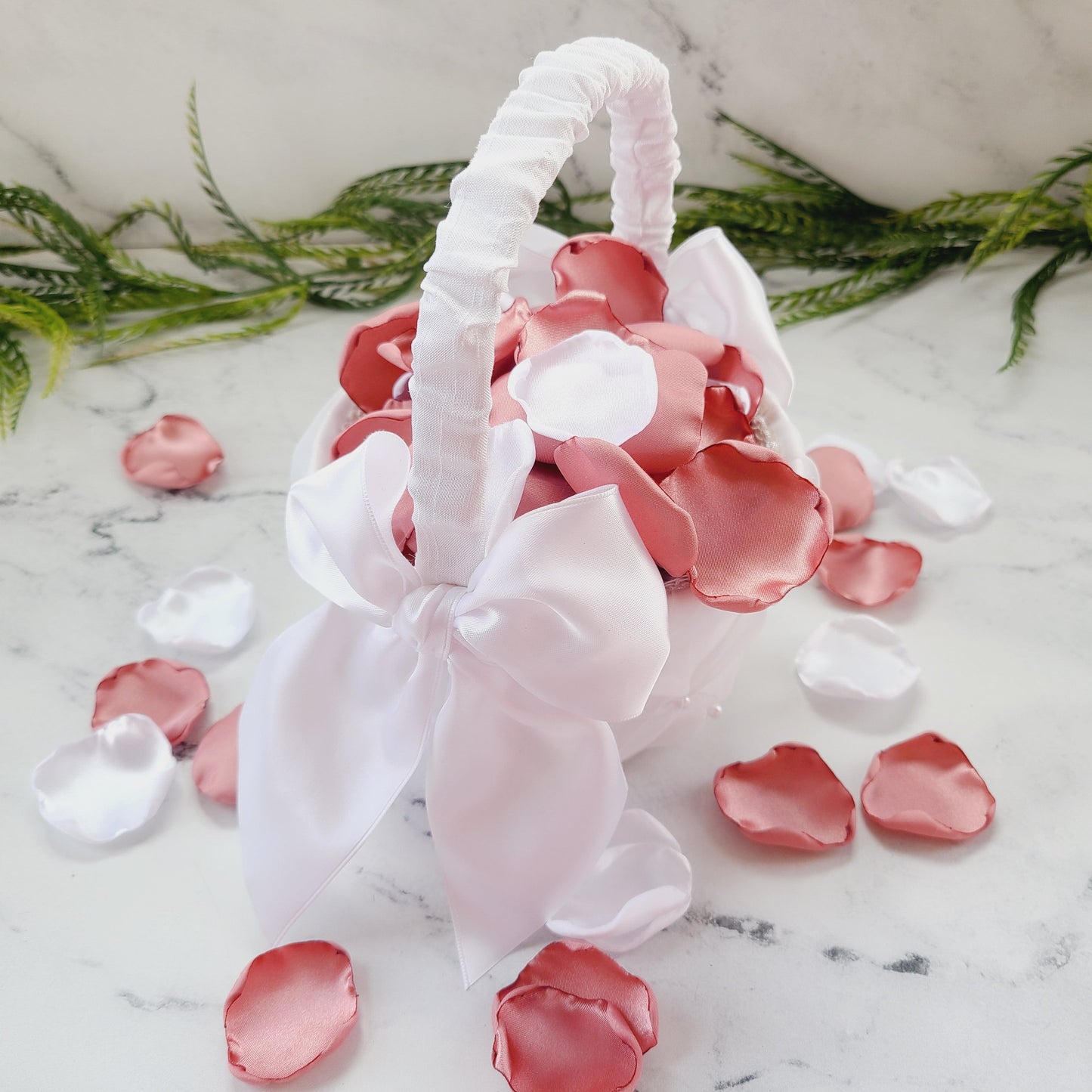 White flower girl basket with white & mauve rose petals, for wedding decor ideas, aisle decorations, table confetti