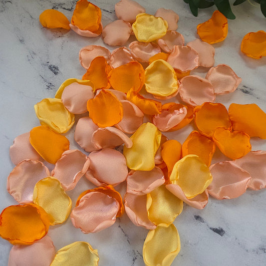 Yellow, Peach Blush, Orange rose petals showcased on table. Perfect for flower girl tossing, wedding aisle decor, reception tablescapes, confetti scatter,  memory table accents, Sunset Wedding Theme Ideas