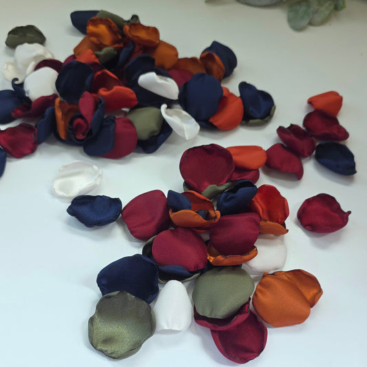 Navy, burnt orange, olive, burgundy, auburn, Ivory rose petals for flower girl basket, aisle decor, table scatter and backdrop accents. A fall wedding color palette for future brides planning a wedding ceremony or a western boho styled bridal shower event.