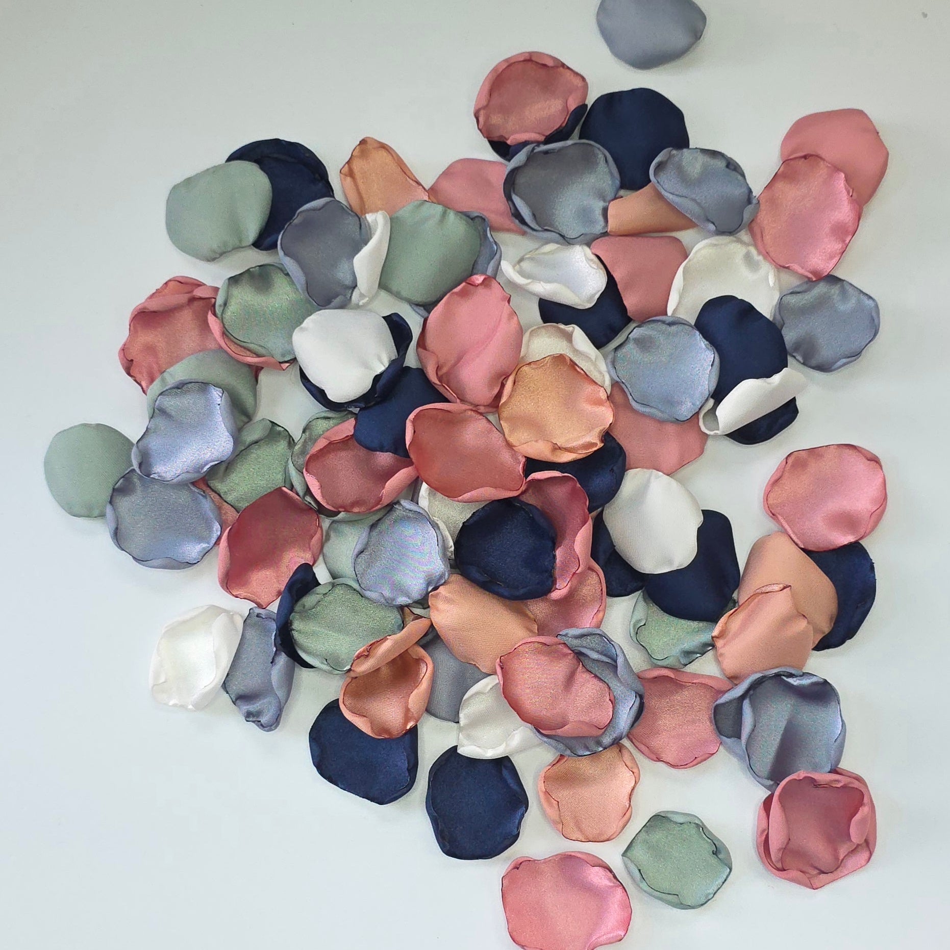 A mix of Dusty twilight Blue, Navy, Dusty Rose, champagne rose pink, dusty sage rose petals. Perfect for flower girl tossing, aisle decor, inspo for wedding decor, tablescape scatter or backdrop accents. A color palette for a future bride planning a wedding ceremony or bridal shower brunch event.