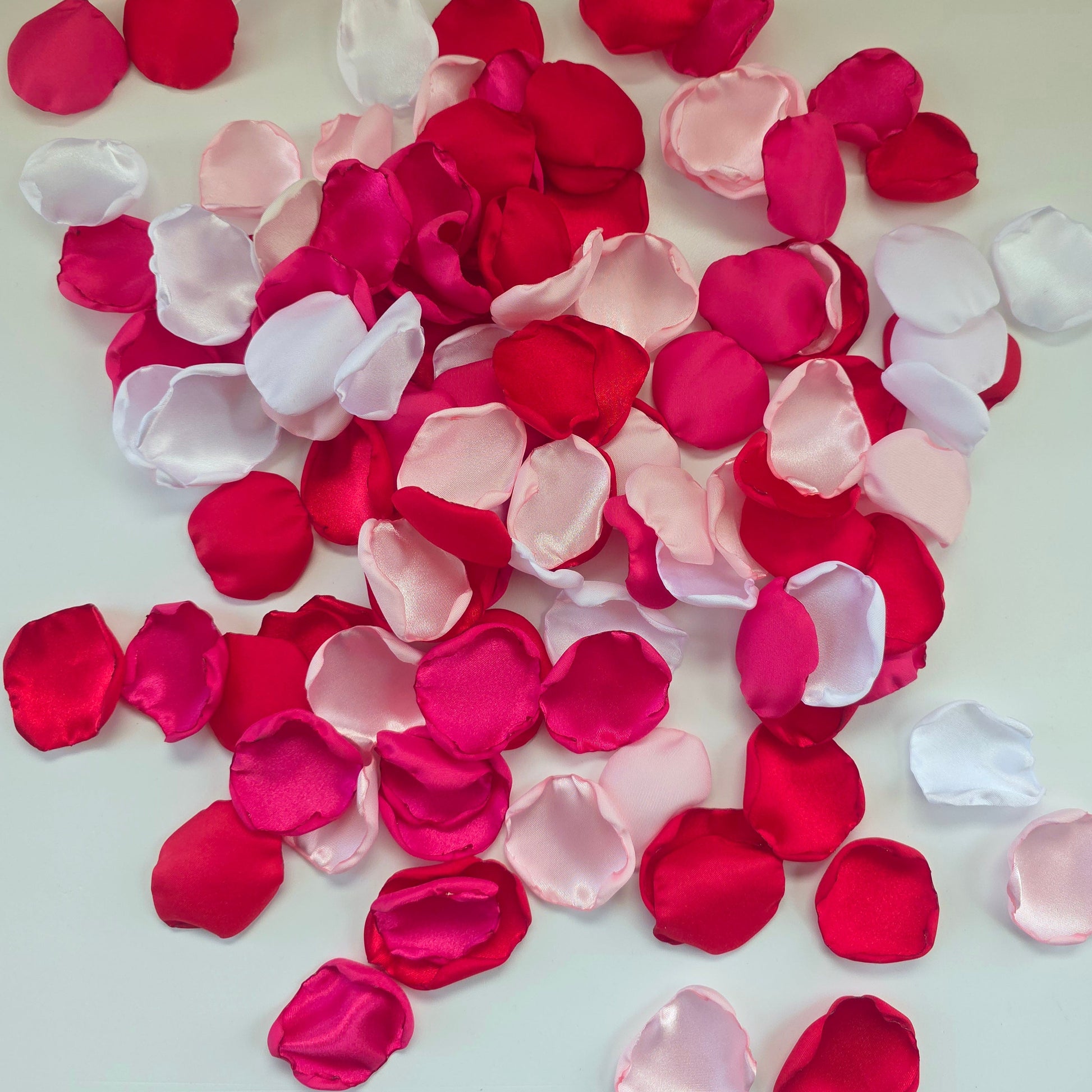 Red, fuchsia, pink and white rose petals for wedding aisle decor, flower girl toss, valentine date night tablescape decor, future bride color scheme ideas, confetti