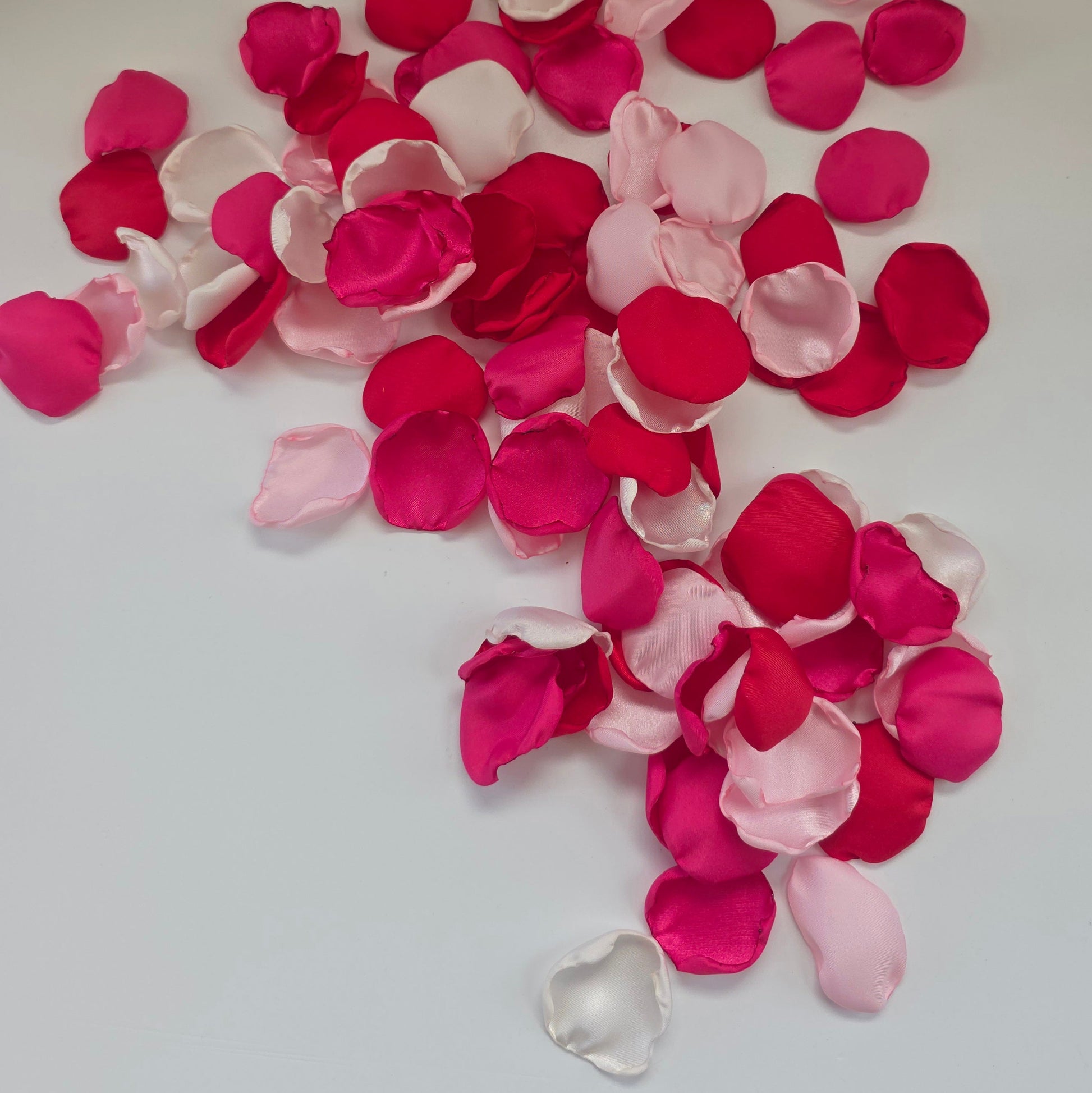 Red, fuchsia, pink and white rose petals for wedding aisle decor, flower girl toss, valentine date night tablescape decor, future bride color scheme ideas, confetti