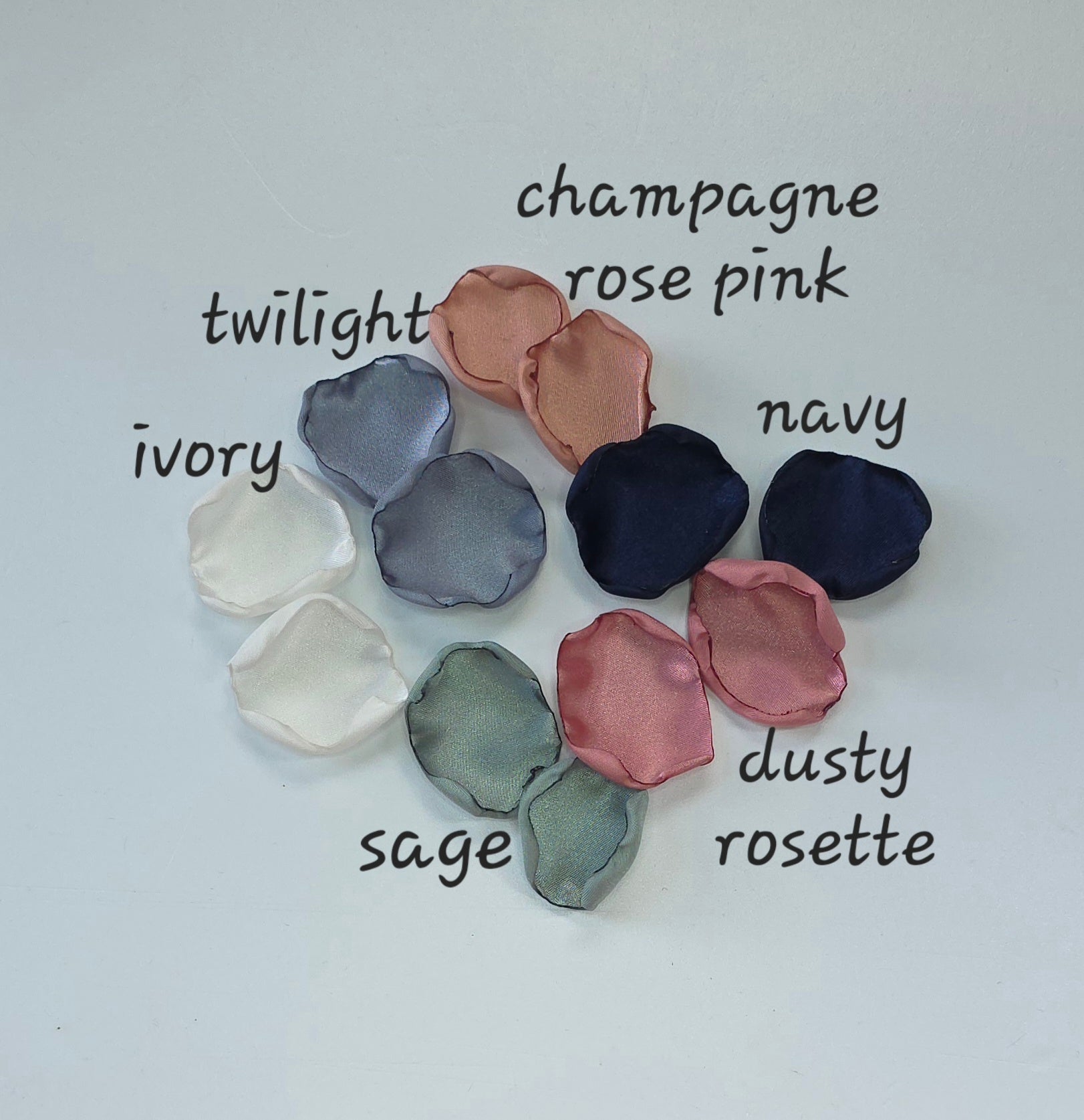 A mix of Dusty Blue, Navy, Dusty Rose, champagne rose pink, dusty sage rose petals. Perfect for flower girl tossing, aisle decor, inspo for wedding decor, tablescape scatter or backdrop accents. A color palette for a future bride planning a wedding ceremony or bridal shower brunch event.